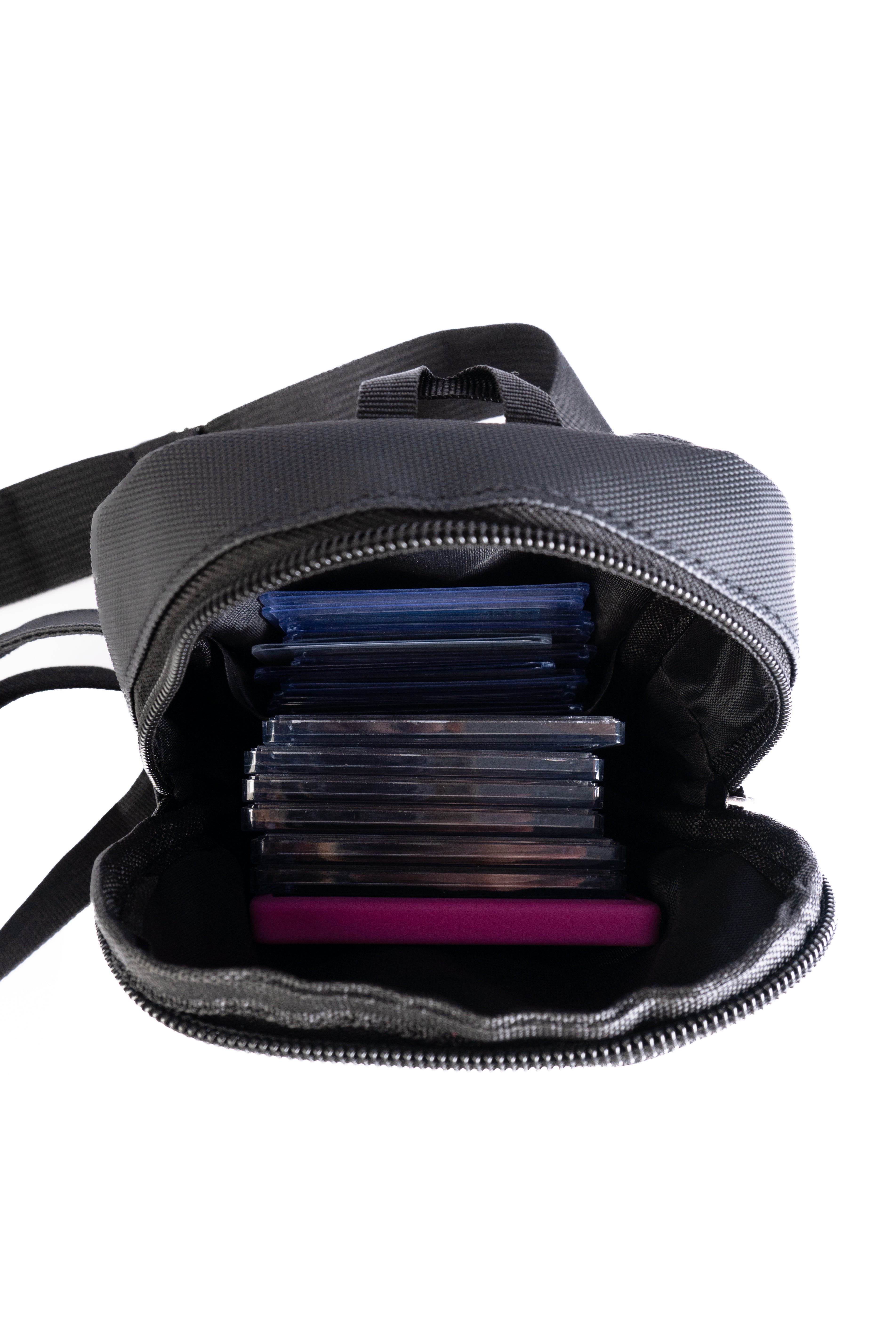 Black backpack with compartments on a white background