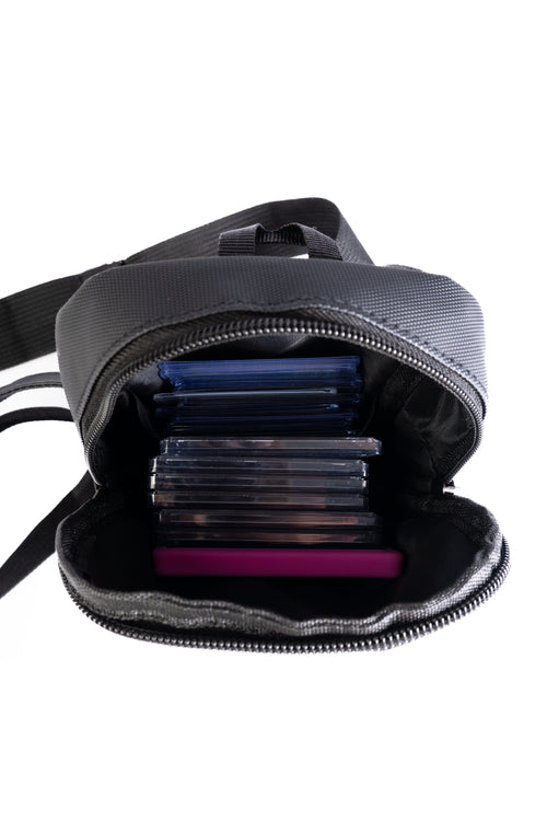 Black backpack with compartments on a white background