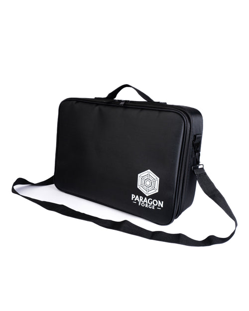 Black bag with a strap featuring the Paragon Forge logo